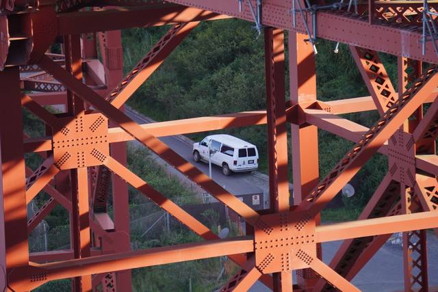 Golden Gate red steelwork detail with a van